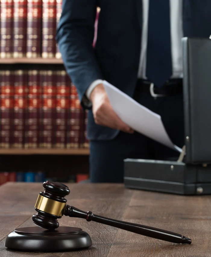 Stock criminal defense attorney with gavel.